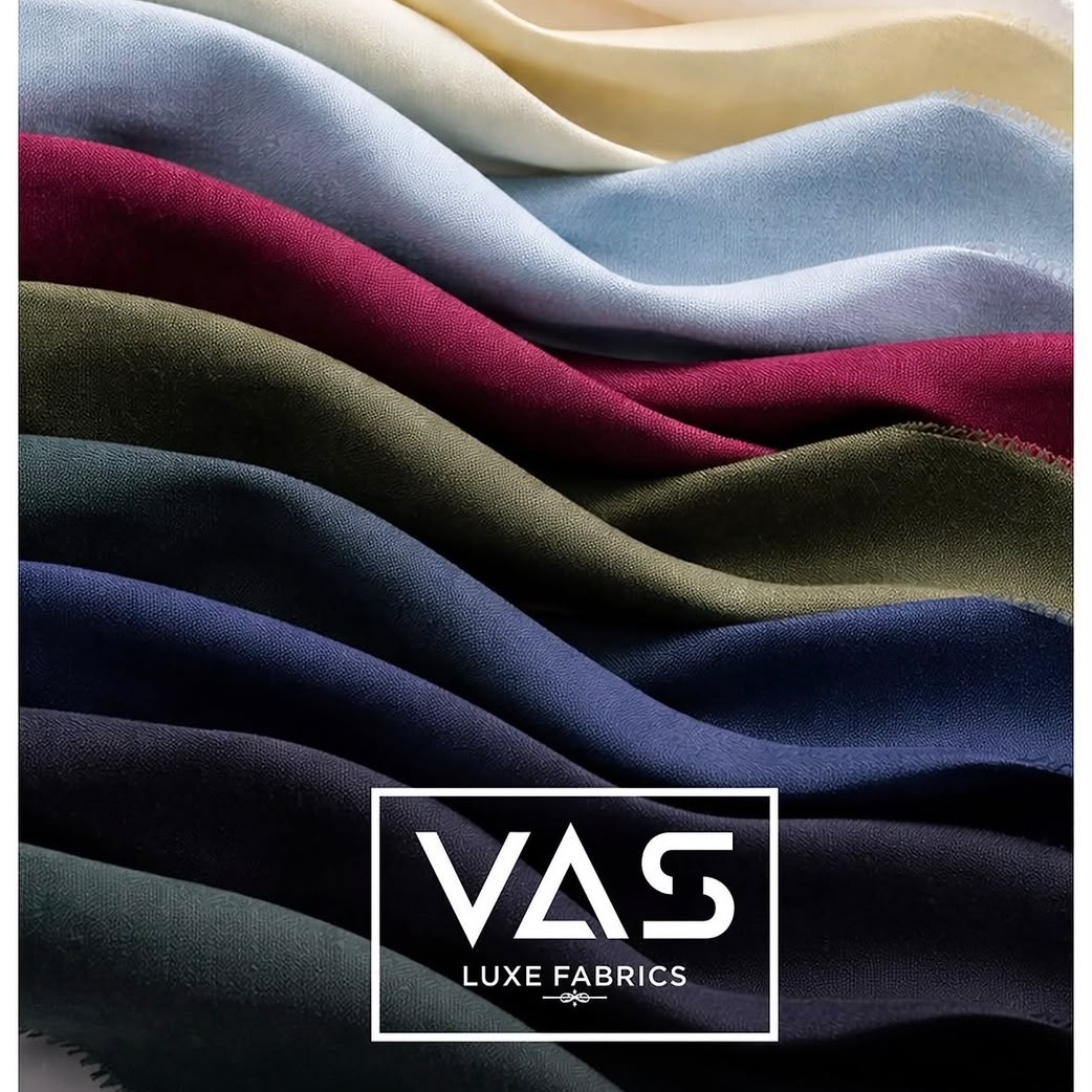 A wave of linen shirting fabrics in cream, blue, maroon, olive and navy
